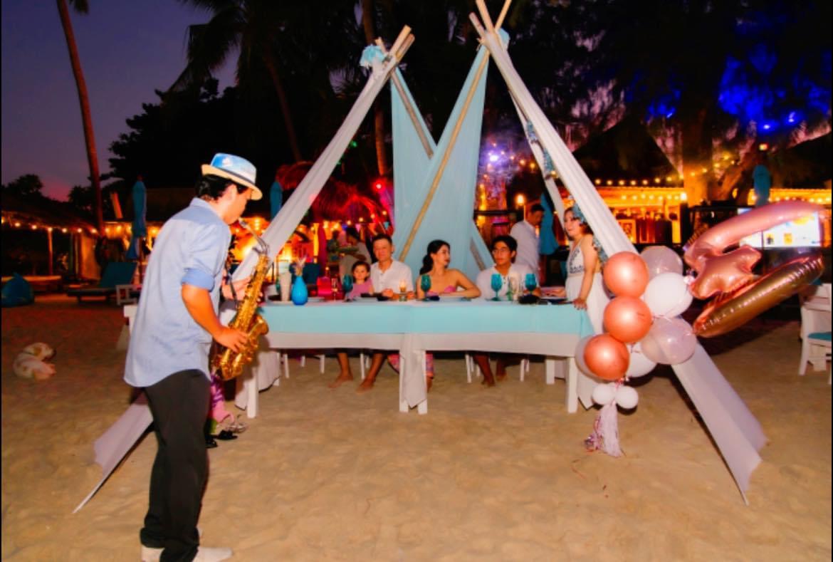 Private beachfront event under elegant tent canopy — sunset sky over Choeng Mon Beach, Koh Samui